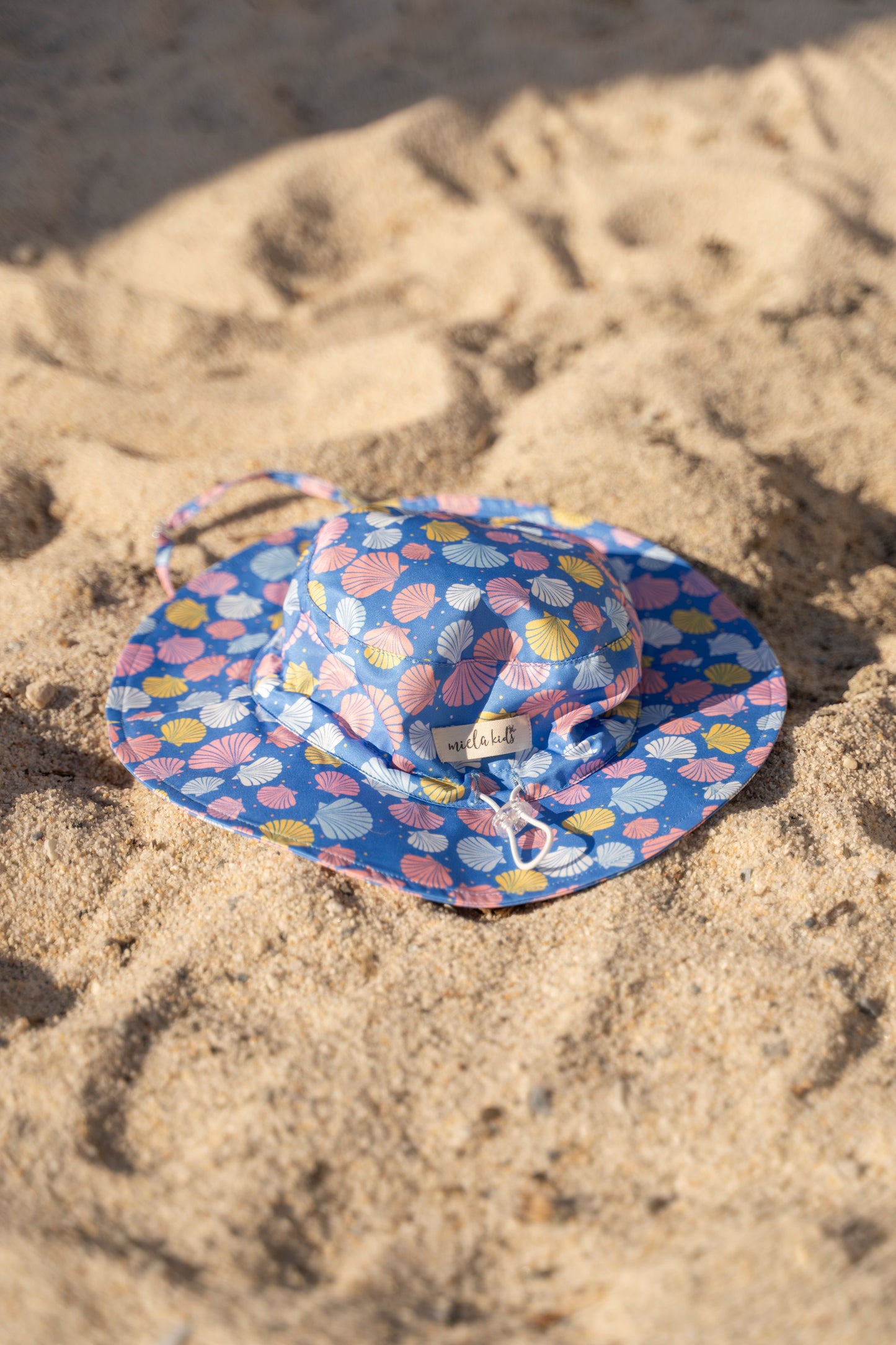 Cappellino da sole bambino con conchiglie UV50+ | MIELA KIDS