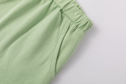 Shorts verde chiaro con volant | NEWNESS