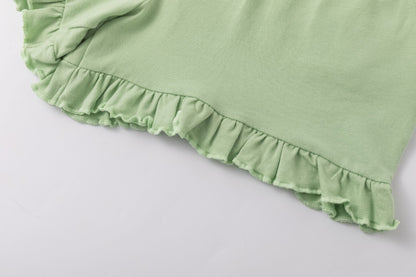 Shorts verde chiaro con volant | NEWNESS